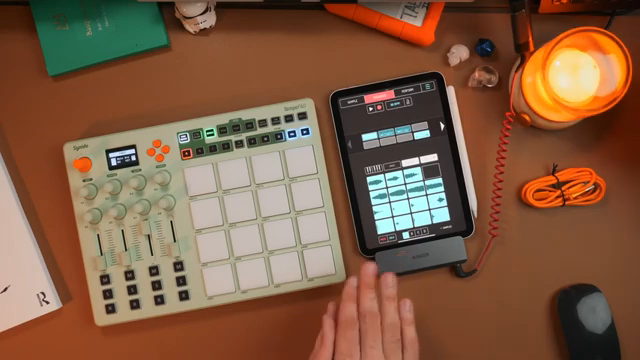 A Bluetooth MIDI controller that you don't need to plug into the mobile device is the way to go.